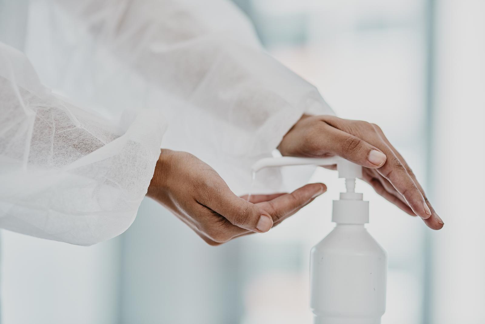44297282_stay-sanitised-stay-safe-cropped-shot-of-a-healthcare-worker-disinfecting-herself-with-hand-sanitiser.jpg