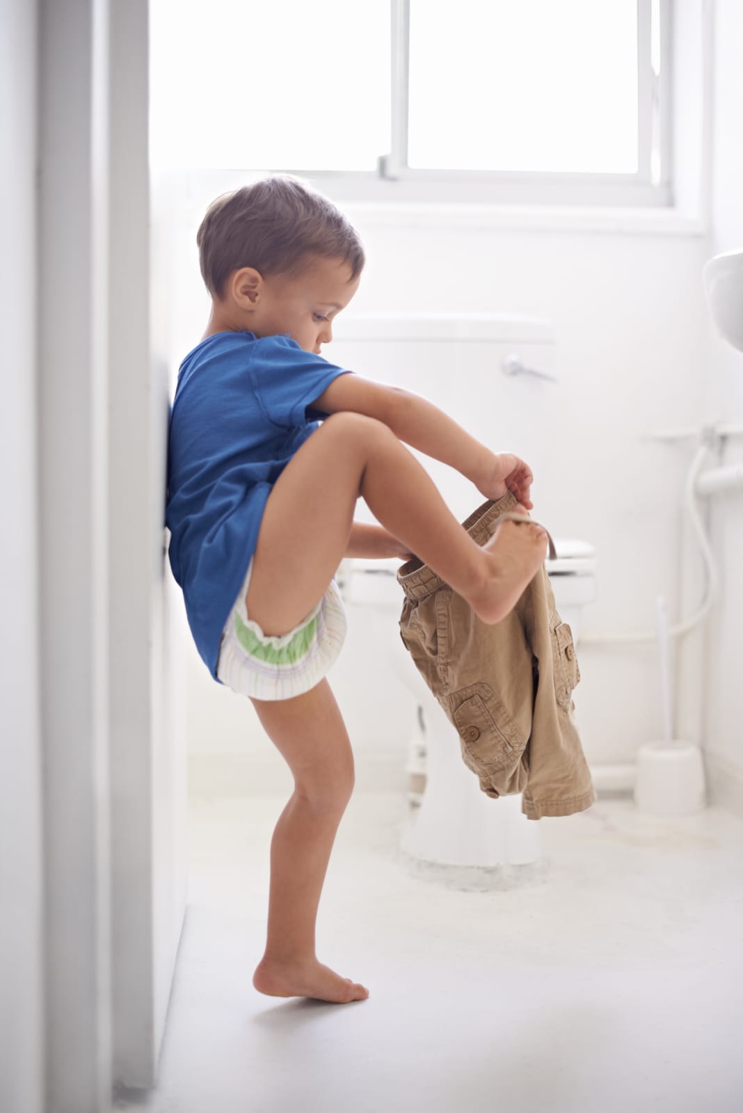 57182368_child-bathroom-and-toilet-training-for-learning-growth-milestone-or-hygiene-male-person-kid-diaper-and-pants-or-step-for-development-in-home-for-parent-care-for-toddler-teaching-health-or-love.jpg